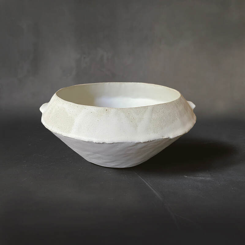 Hand-built large serving bowl raku with dolomite glaze.