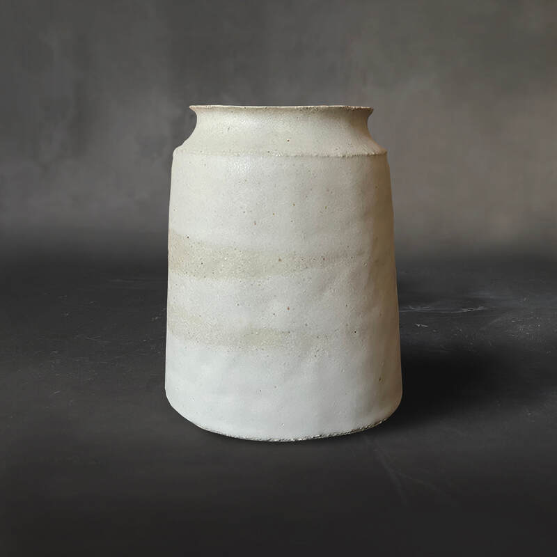 Hand-built medium raku vase with dolomite glaze.