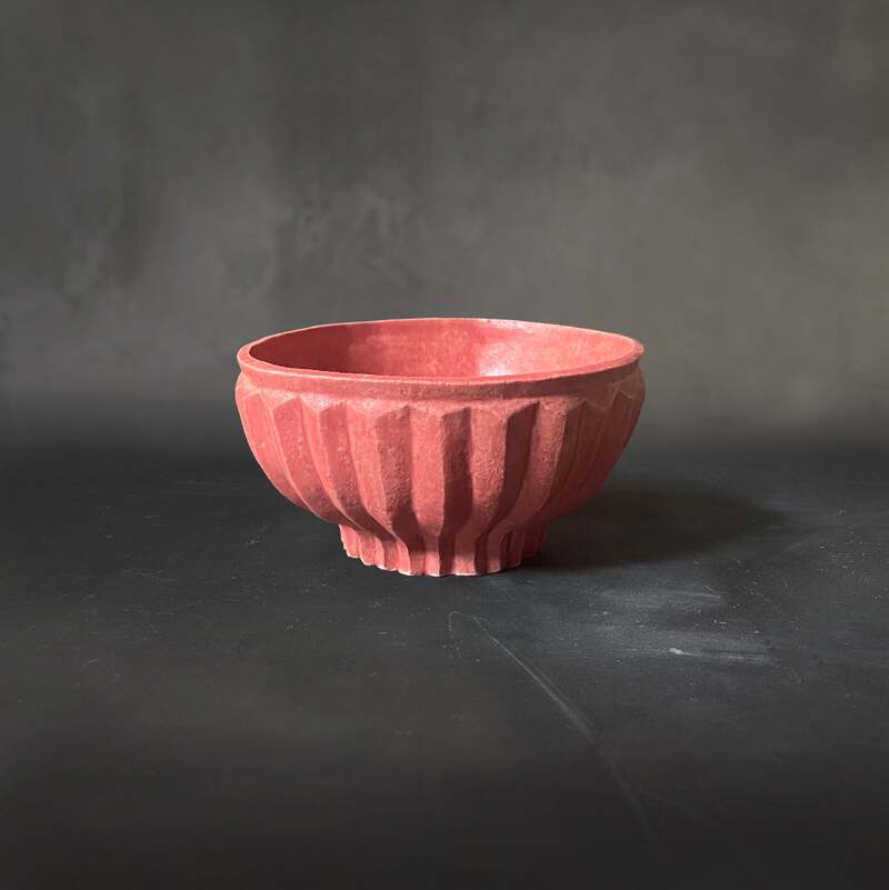 Hand-built and carved raku bowl with cayenne matt glaze.