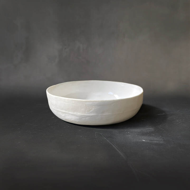 Hand-built porcelain bowl with white gloss glaze.
