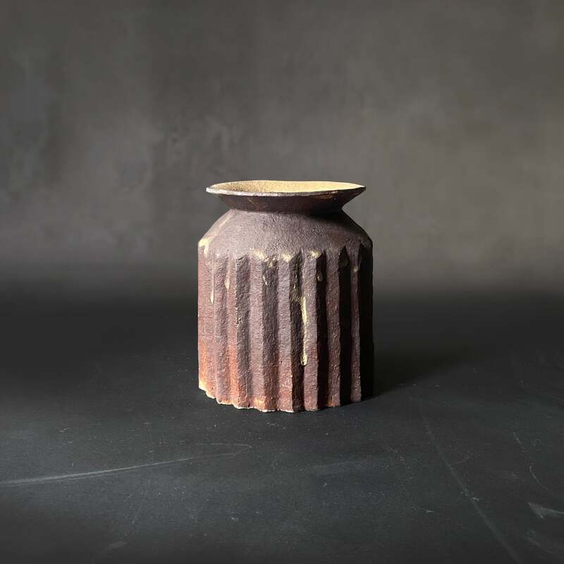 Hand-built and carved pleated raku vase with antique glaze