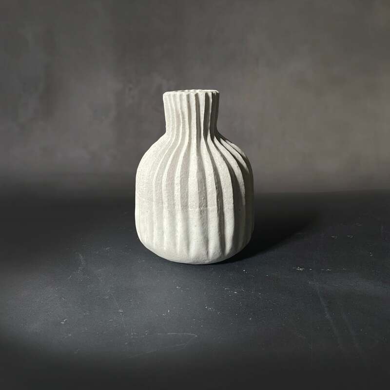 Hand-built and carved white vase.